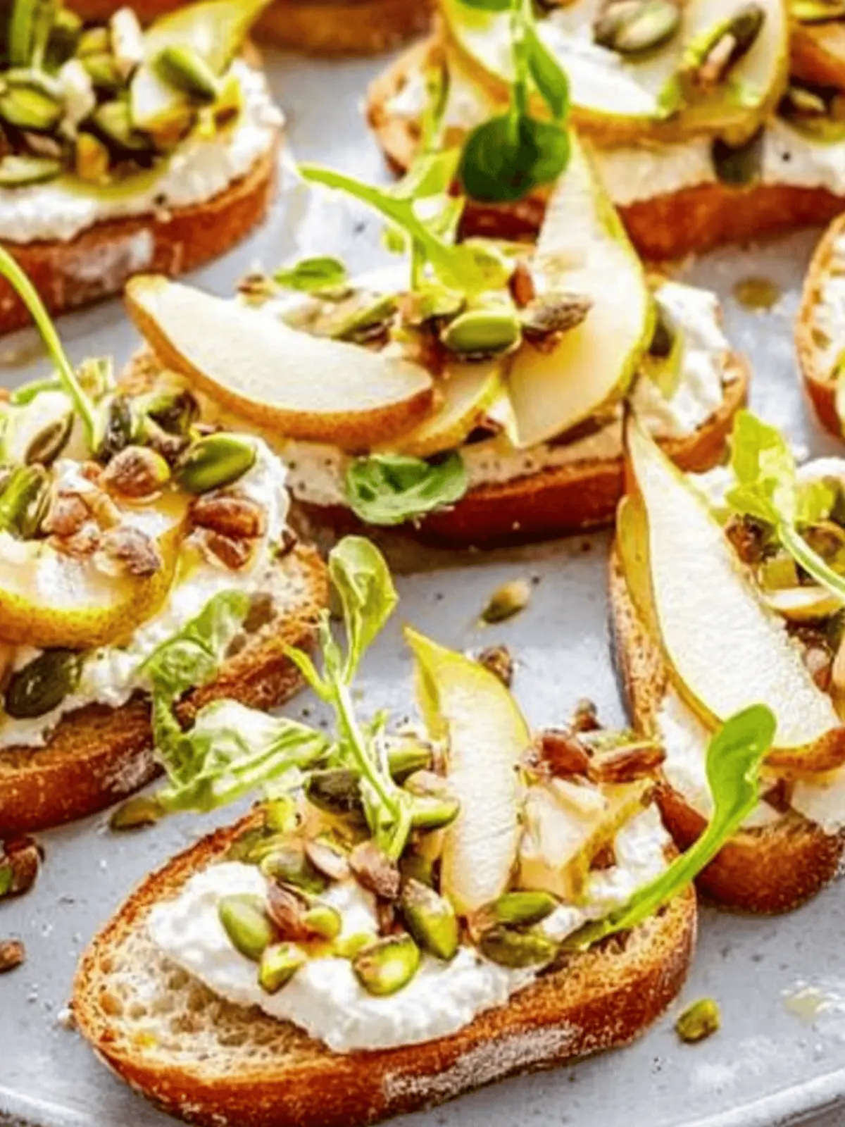 Ricotta and Pear Crostini with Salty Pumpkin Seed Pistachio Crunch